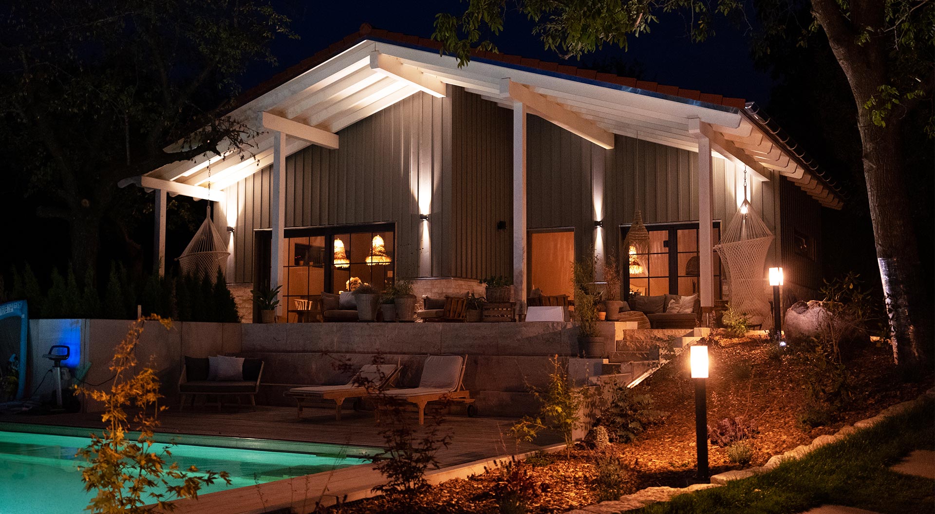 Garden chalet with atmospheric lighting at night